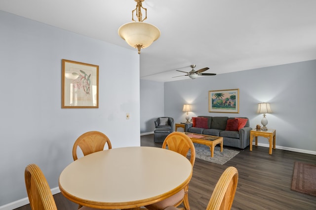 dining room with dark hardwood / wood-style floors and ceiling fan