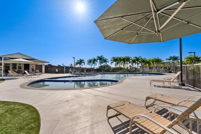 view of swimming pool featuring a patio area