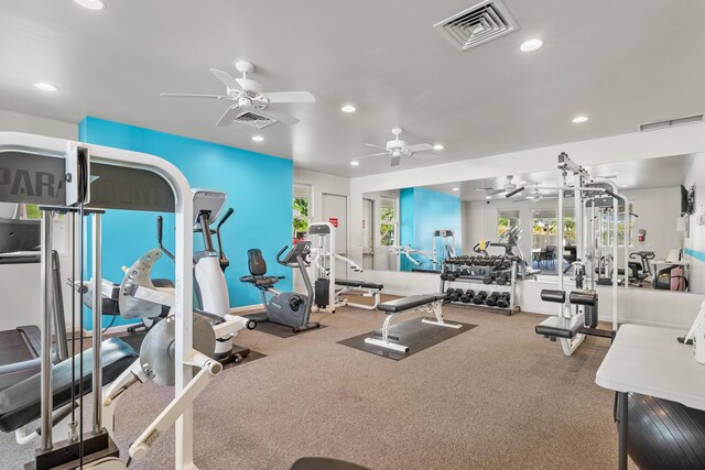 workout area featuring carpet flooring and ceiling fan