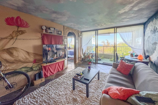 living room with light tile patterned flooring and a healthy amount of sunlight