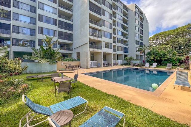 view of swimming pool with a patio area