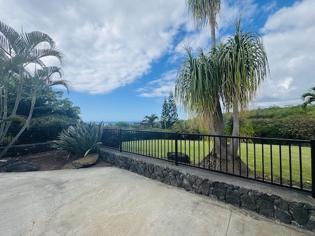 view of gate featuring a lawn