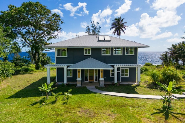 view of front of property featuring covered porch and a front yard