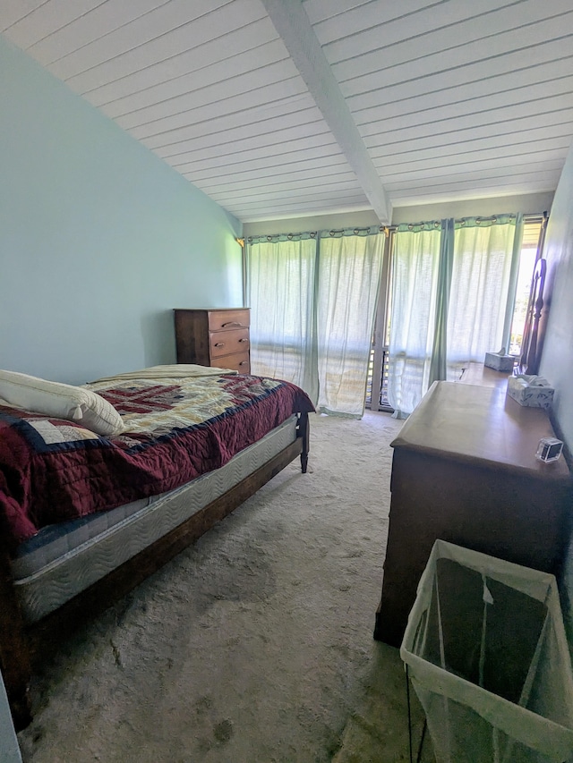 bedroom featuring carpet, access to outside, and beamed ceiling