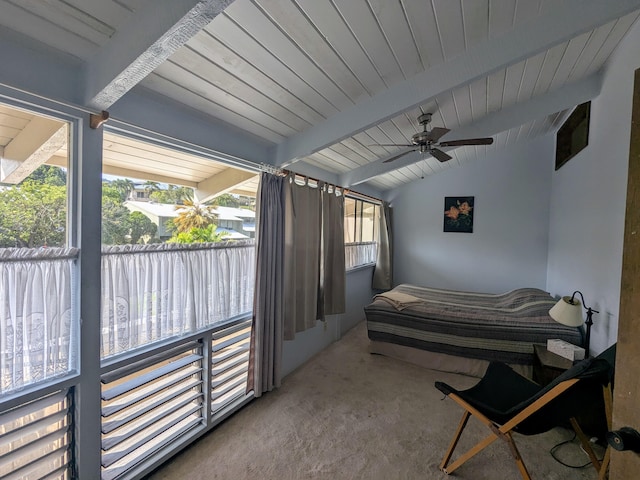 bedroom with ceiling fan, lofted ceiling with beams, and carpet flooring