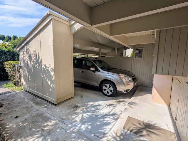 garage featuring a carport