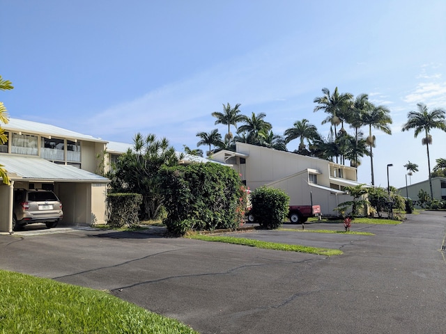 exterior space featuring a carport