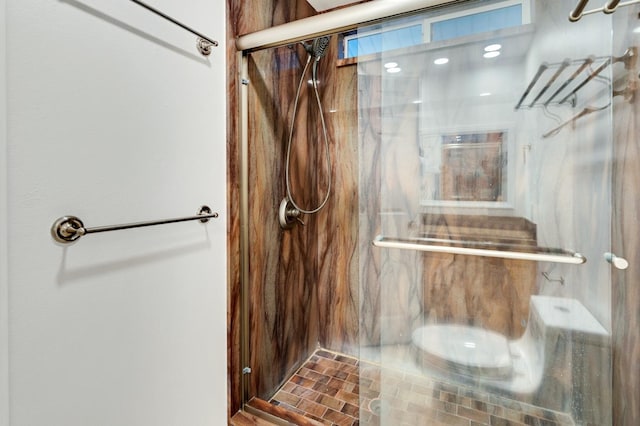 bathroom with a shower with shower door