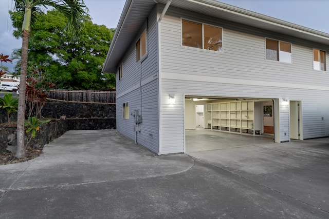 view of side of home featuring a garage