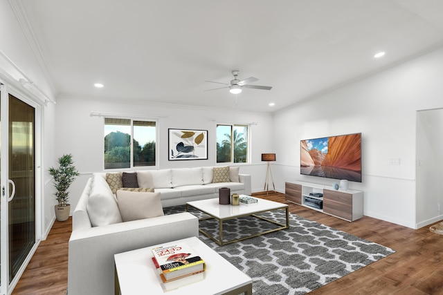 living room featuring hardwood / wood-style flooring, plenty of natural light, ceiling fan, and crown molding