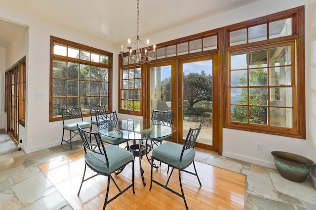 dining area with an inviting chandelier