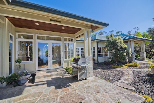 view of patio / terrace with area for grilling and french doors