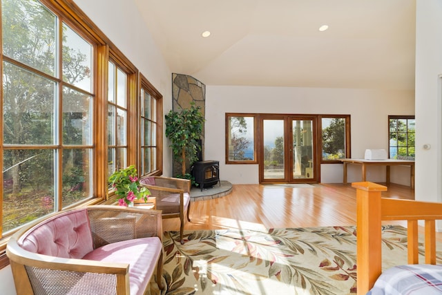 sunroom featuring a wood stove