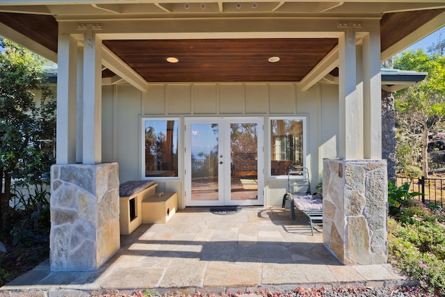 property entrance with french doors and a patio area