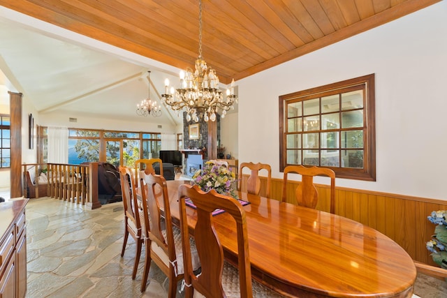 dining area with a chandelier, wood ceiling, and vaulted ceiling