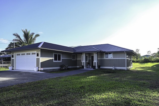 ranch-style home with a garage and a front lawn