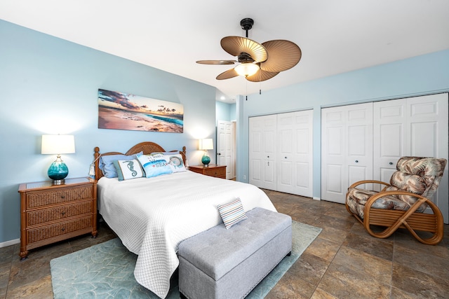 bedroom featuring ceiling fan and multiple closets