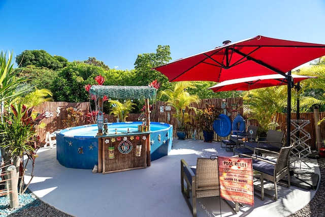 view of patio / terrace featuring a fenced in pool