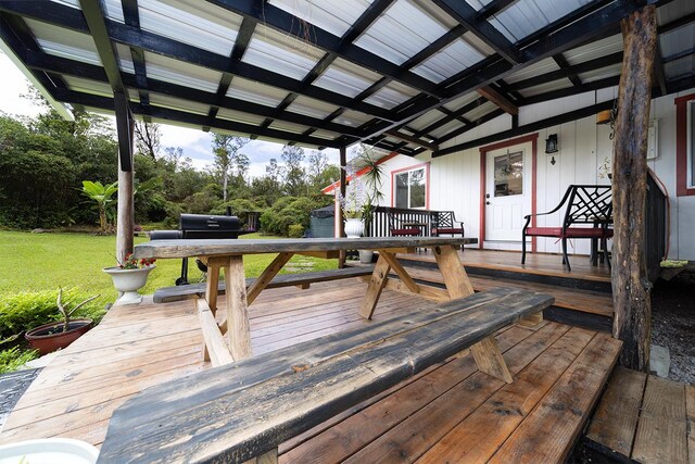 wooden deck with a lawn