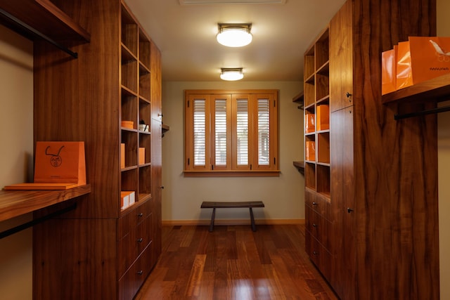 spacious closet with dark wood finished floors and visible vents