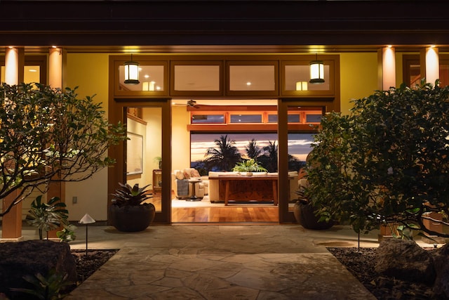 property entrance featuring a patio area and stucco siding