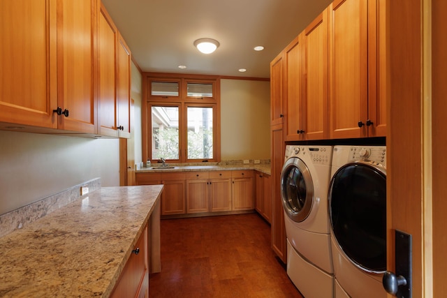 laundry area with recessed lighting, separate washer and dryer, a sink, cabinet space, and dark wood finished floors