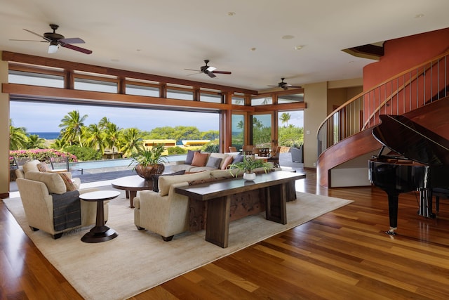 living room featuring stairs and wood finished floors