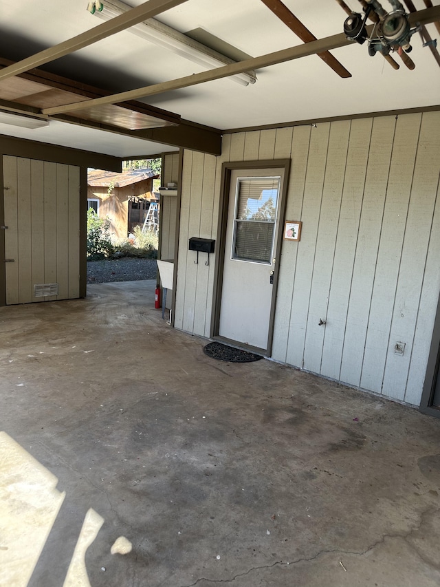 garage with wood walls