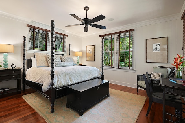 bedroom with ceiling fan, dark hardwood / wood-style floors, and ornamental molding