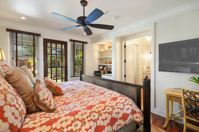 bedroom featuring hardwood / wood-style floors, ceiling fan, and ornamental molding