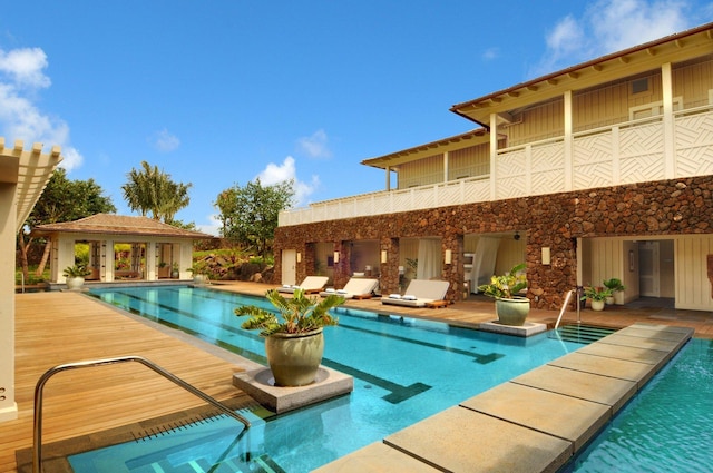 view of swimming pool with an outbuilding