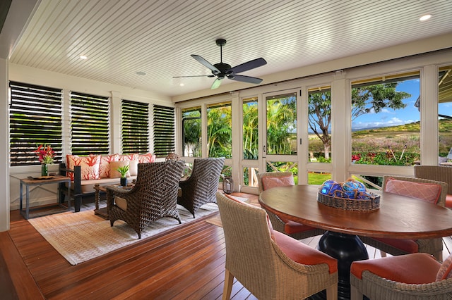 sunroom with wood ceiling, ceiling fan, and a healthy amount of sunlight