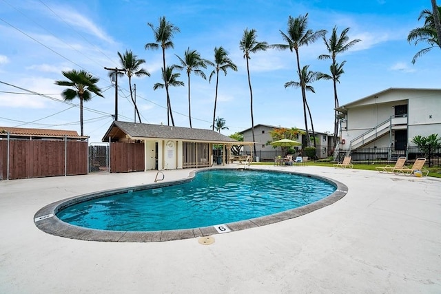 view of pool featuring a patio and an outdoor structure