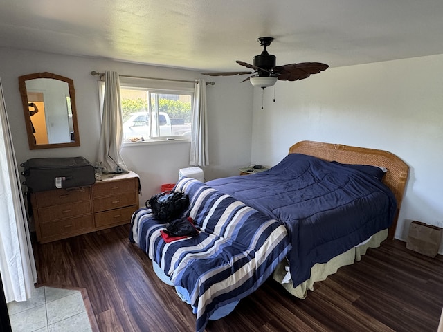 bedroom featuring ceiling fan and dark hardwood / wood-style floors