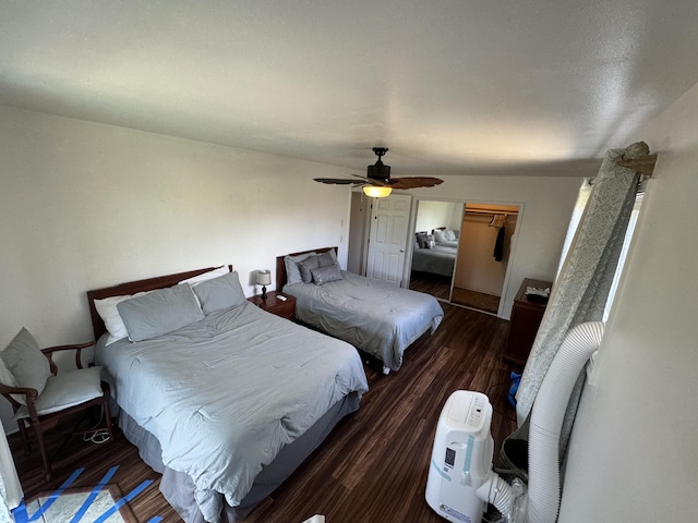 bedroom featuring a closet, vaulted ceiling, ceiling fan, and dark hardwood / wood-style floors