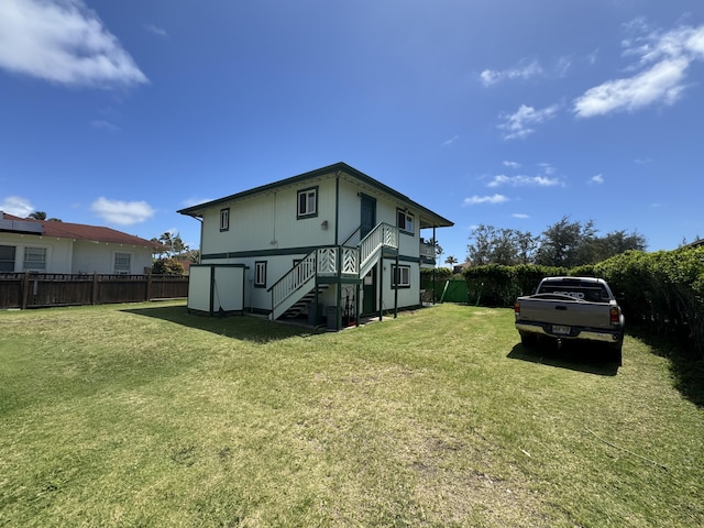 back of house with a yard