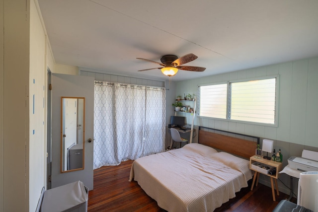 bedroom featuring ceiling fan and dark hardwood / wood-style flooring