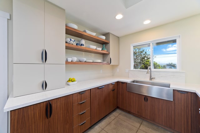 kitchen with sink and light tile patterned floors