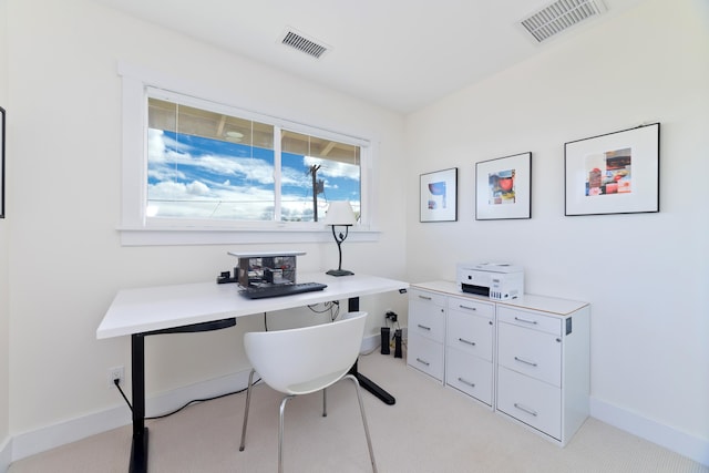 office area featuring light colored carpet