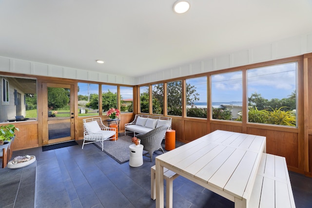 sunroom with a water view