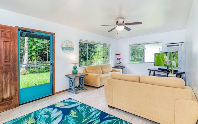 living room with a wall mounted air conditioner, ceiling fan, and light tile patterned flooring