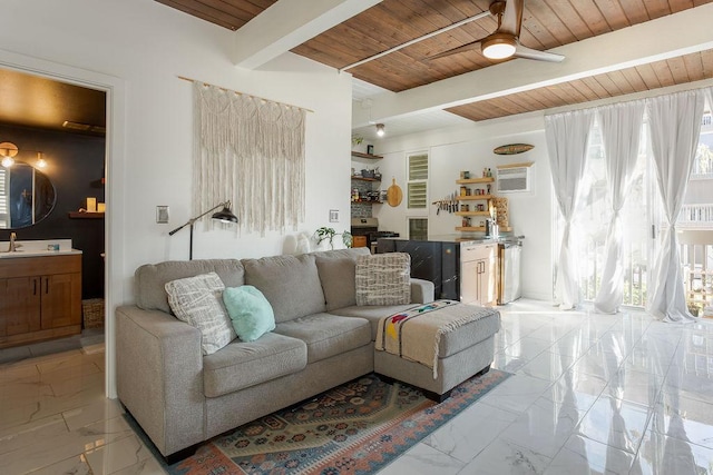 living room featuring wood ceiling, a wall mounted AC, ceiling fan, sink, and beam ceiling