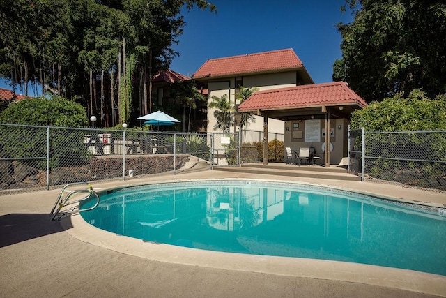 view of swimming pool featuring a patio