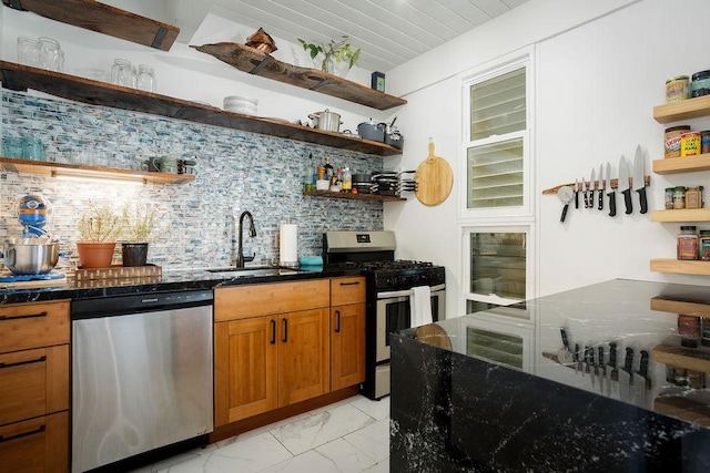 kitchen featuring backsplash, dark stone countertops, sink, and appliances with stainless steel finishes