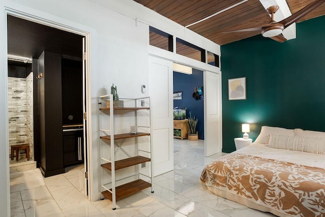 bedroom with ceiling fan, ensuite bathroom, and wooden ceiling