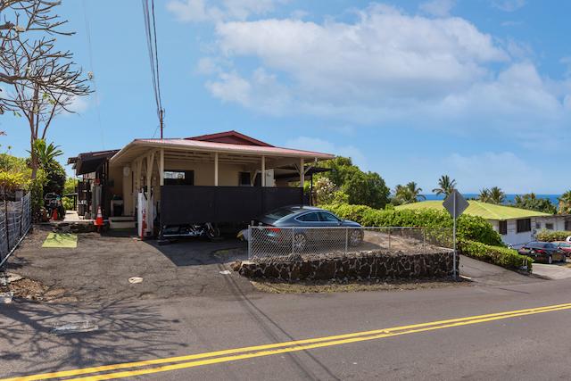 view of front of home featuring fence