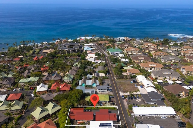 birds eye view of property with a water view and a residential view