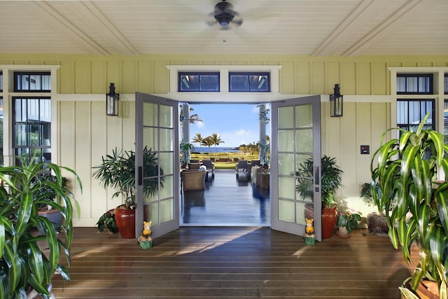 view of exterior entry featuring ceiling fan