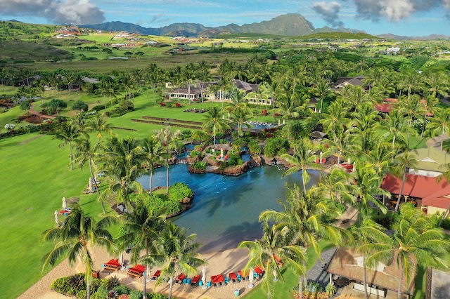 birds eye view of property with a water and mountain view