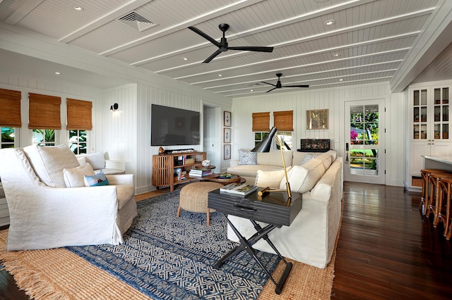 living room with ceiling fan and dark hardwood / wood-style flooring